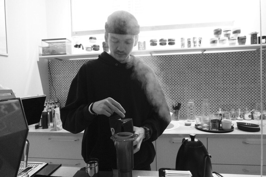 AeroPress coffee being brewed in a modern kitchen