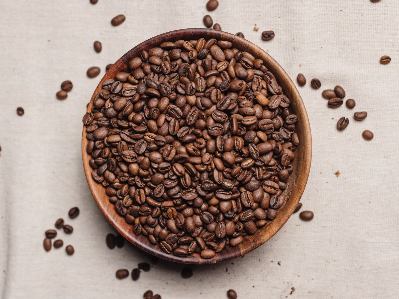 Top view of fresh whole coffee beans in a bowl