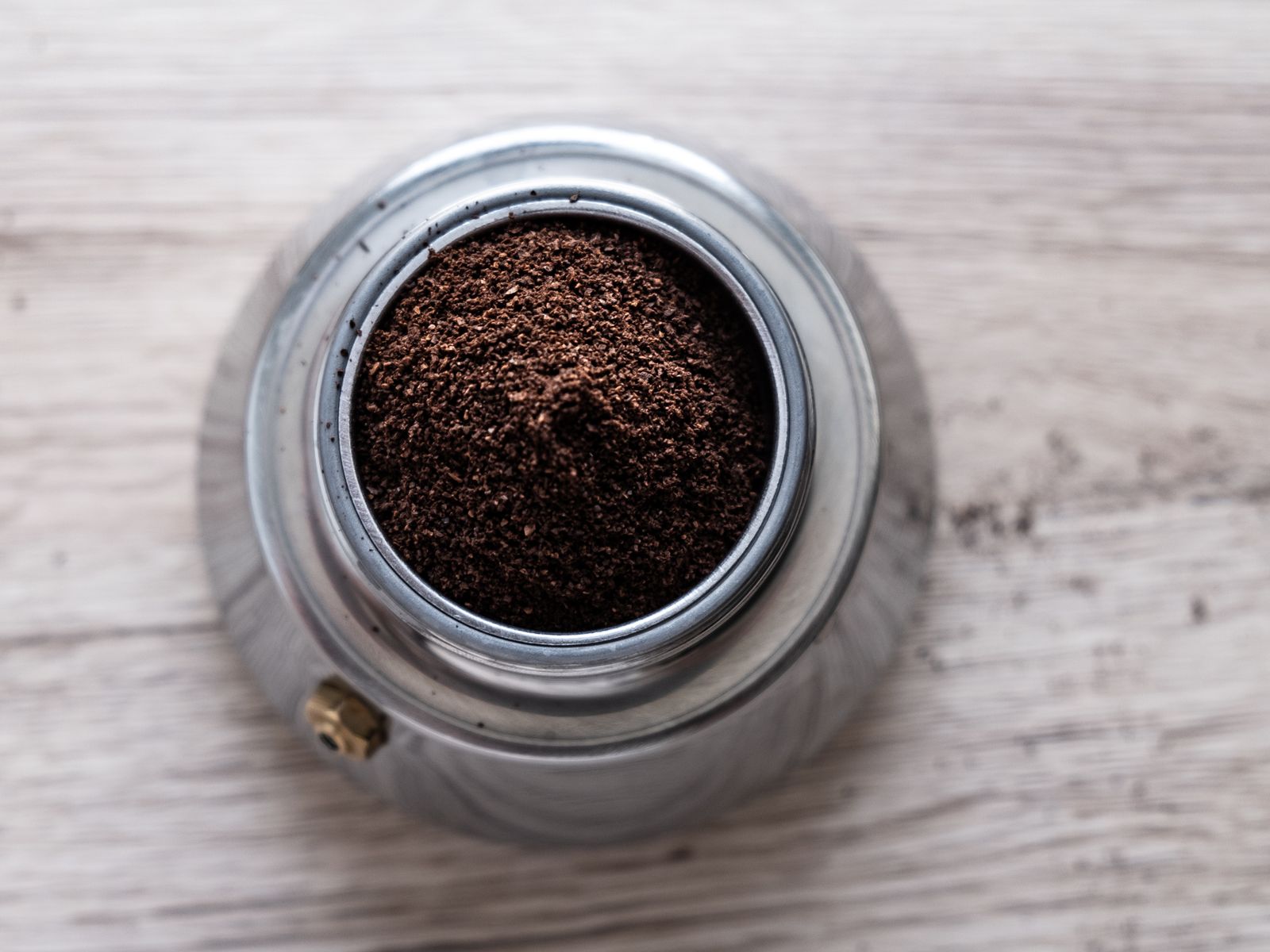 Top view of freshly ground coffee showing grind texture