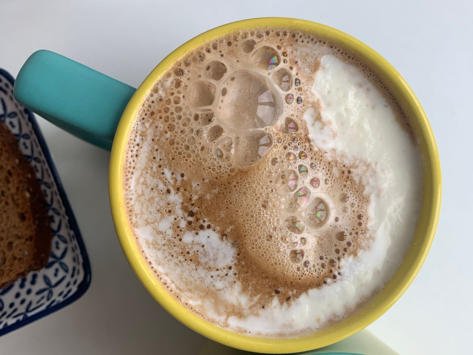 Frothy cappuccino with thick milk foam in coffee cups