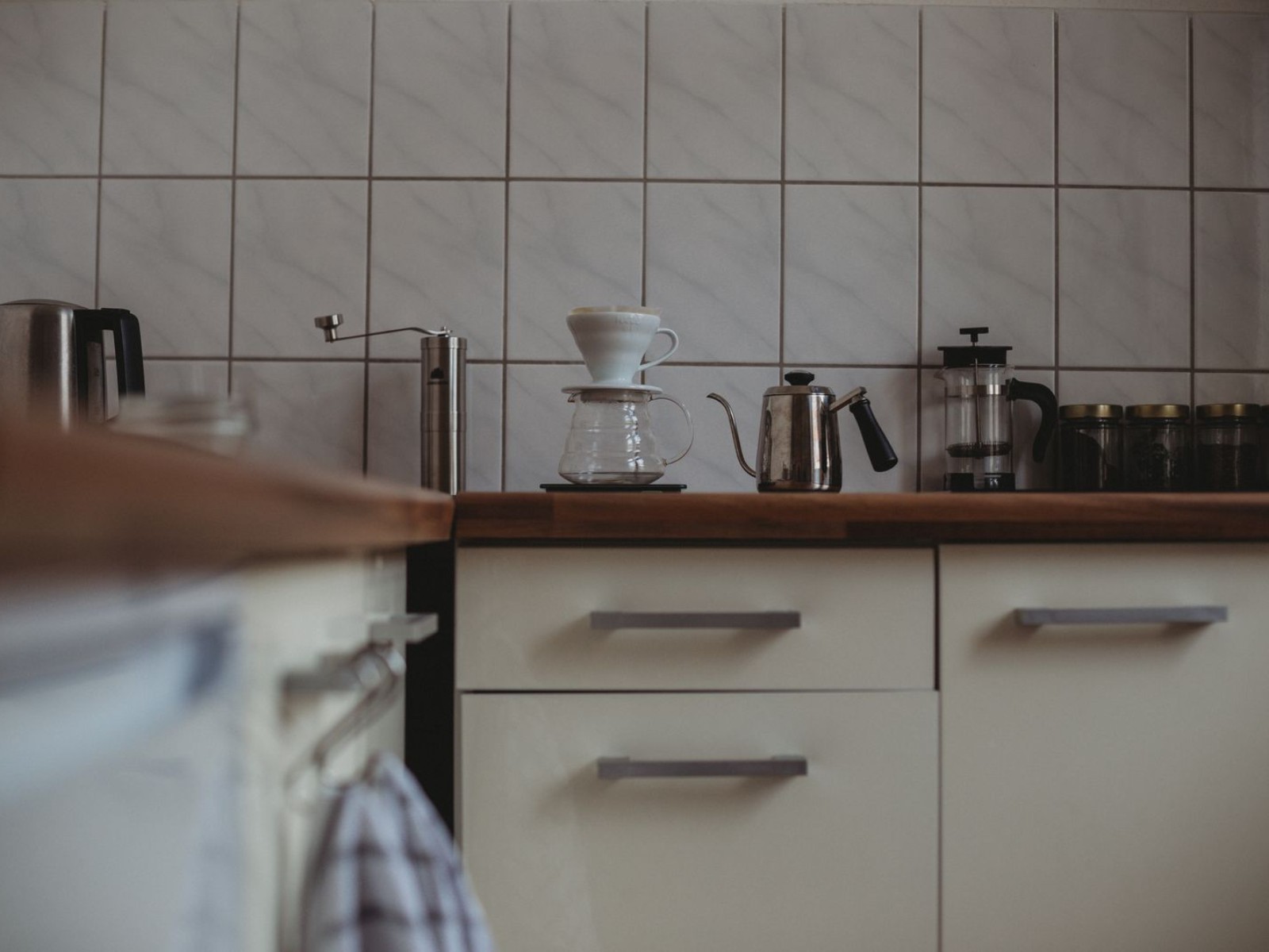 A kitchen corner arranged with coffee-making equipment