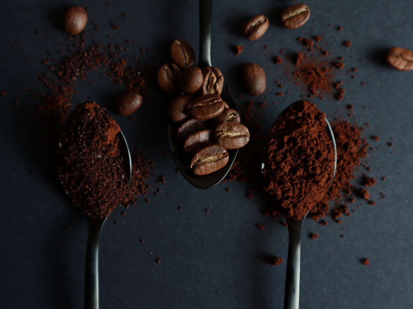 Medium-fine grounds for moka pot coffee on a spoon