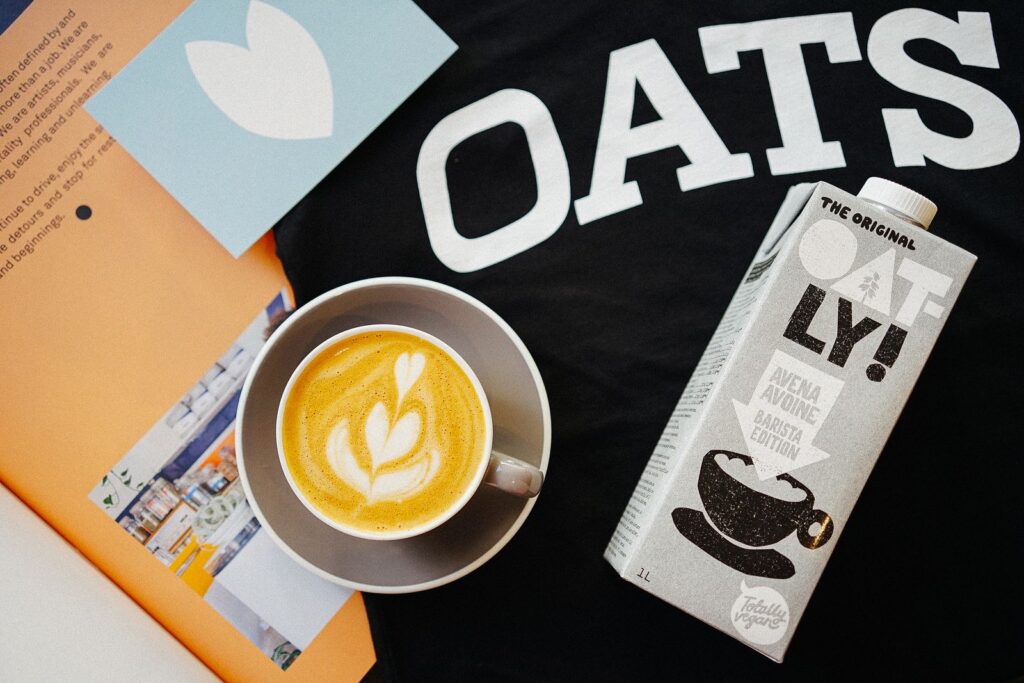Cappuccino made with oat milk showing latte art, one of the best milk alternatives for latte art