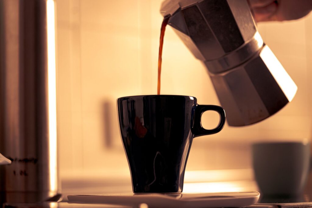 Moka pot coffee being poured, stovetop espresso at home
