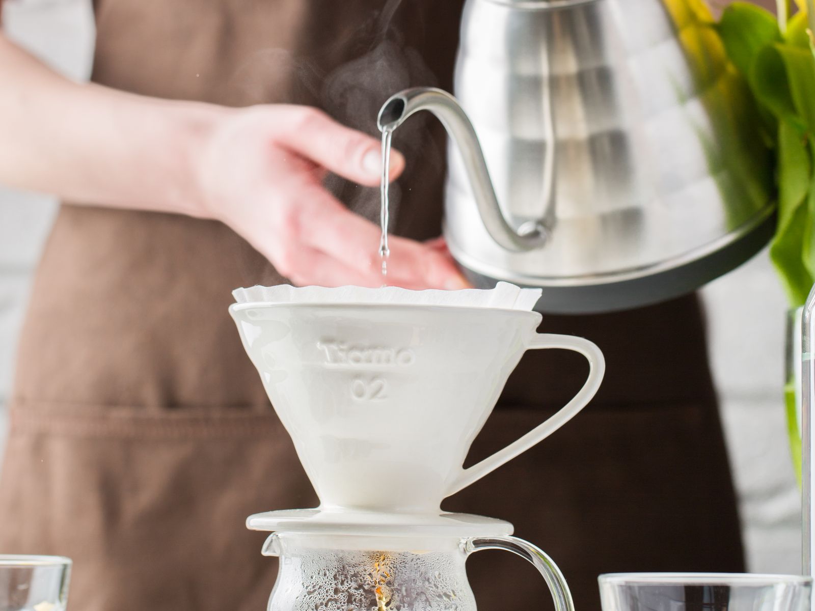 Close-up of pour-over coffee brewing and dripping into a cup