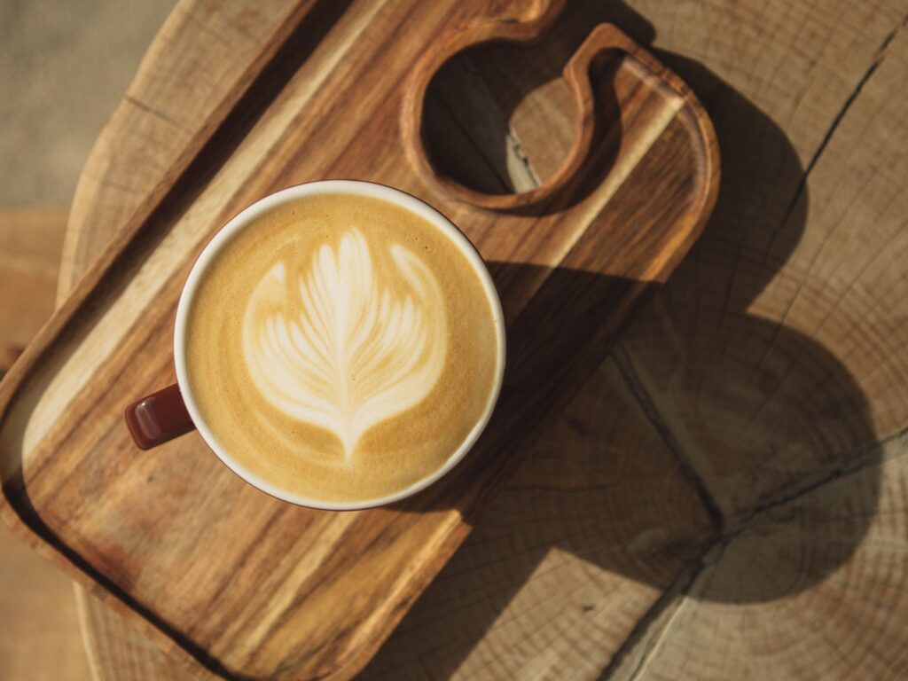 A finished rosetta leaf pattern poured on a latte