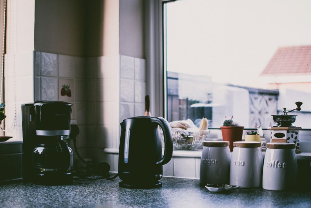 Compact coffee maker and kettle in a cozy small kitchen
