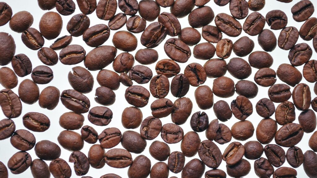 Close-up of whole roasted coffee beans