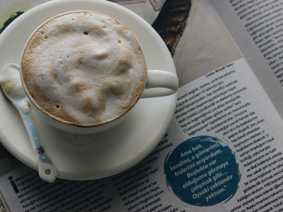 A steaming cappuccino topped with thick milk foam