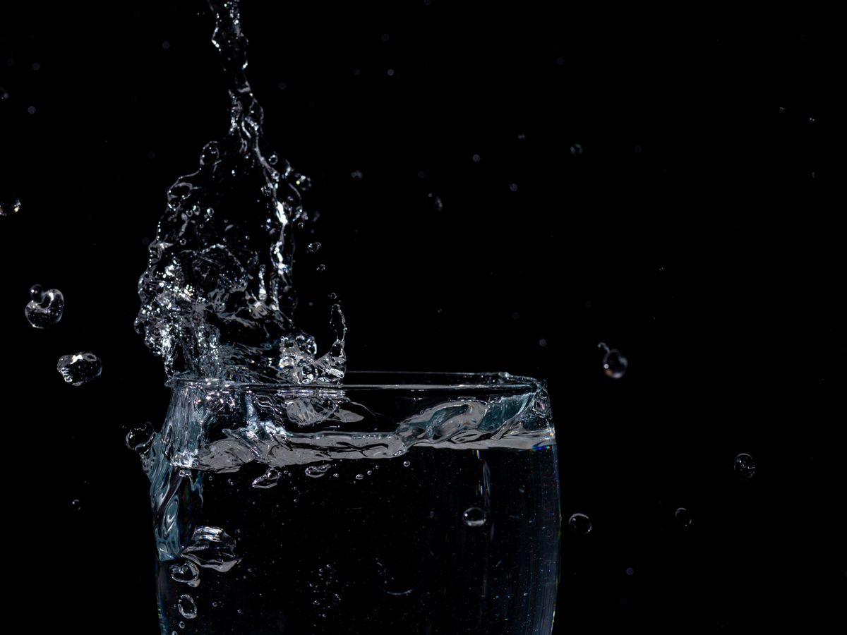 Close-up of clean water splashing in a glass