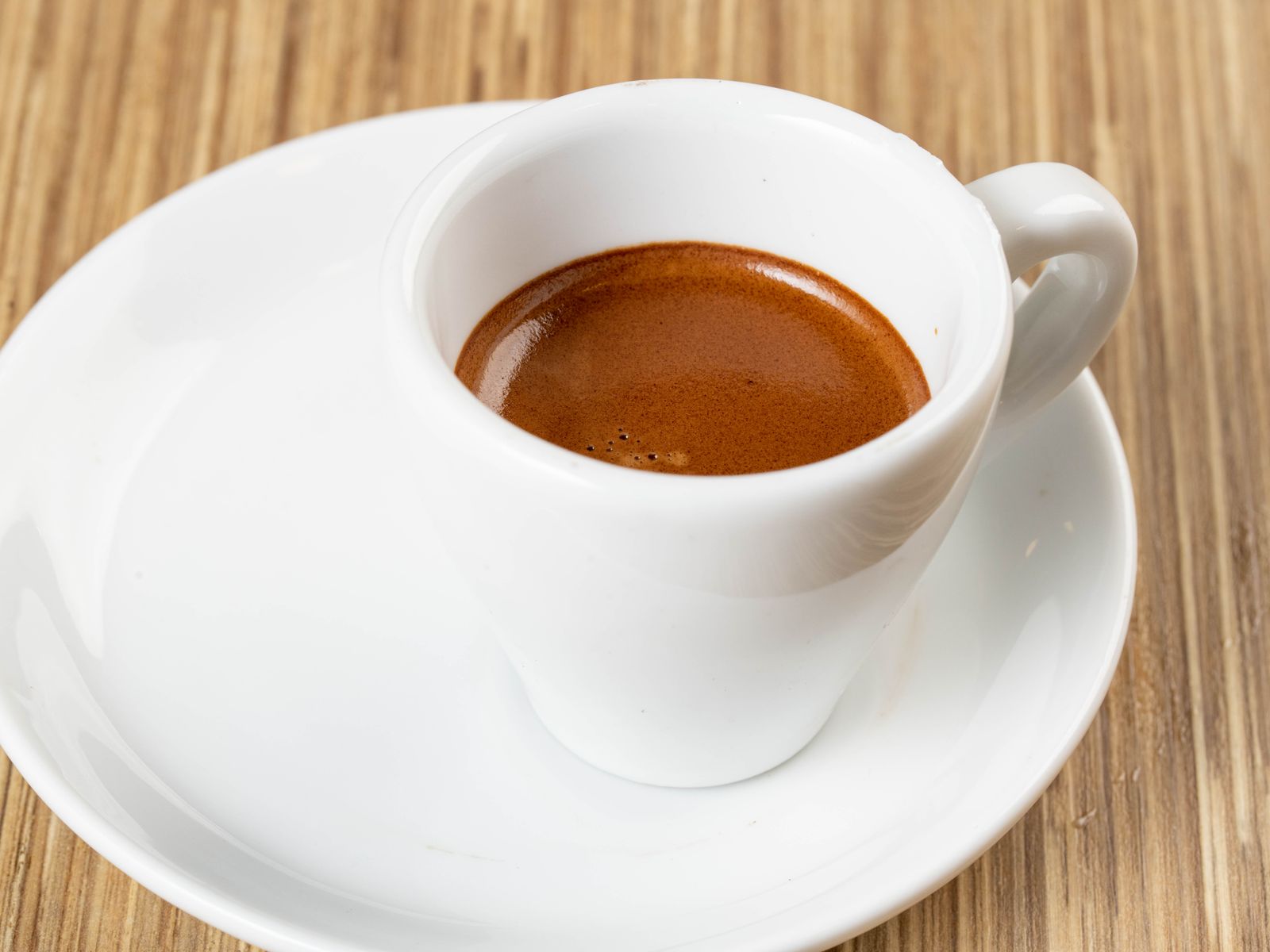 A small, espresso-forward cup like a traditional macchiato