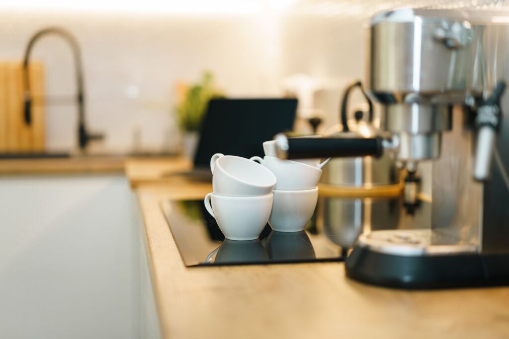 A home espresso machine on a kitchen counter, showing if an espresso machine is worth it