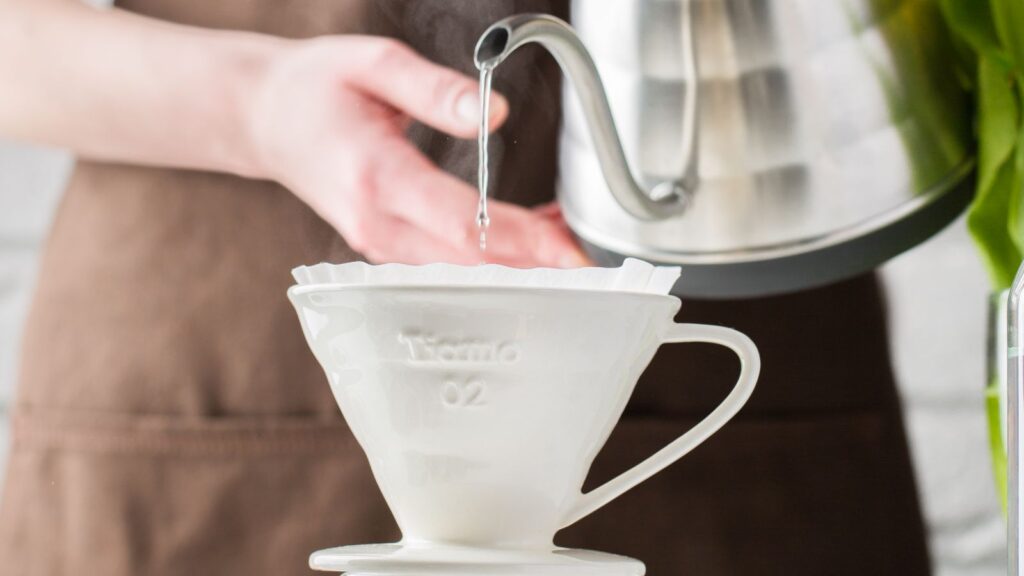 Pour-over troubleshooting: pouring water from a gooseneck kettle into a dripper