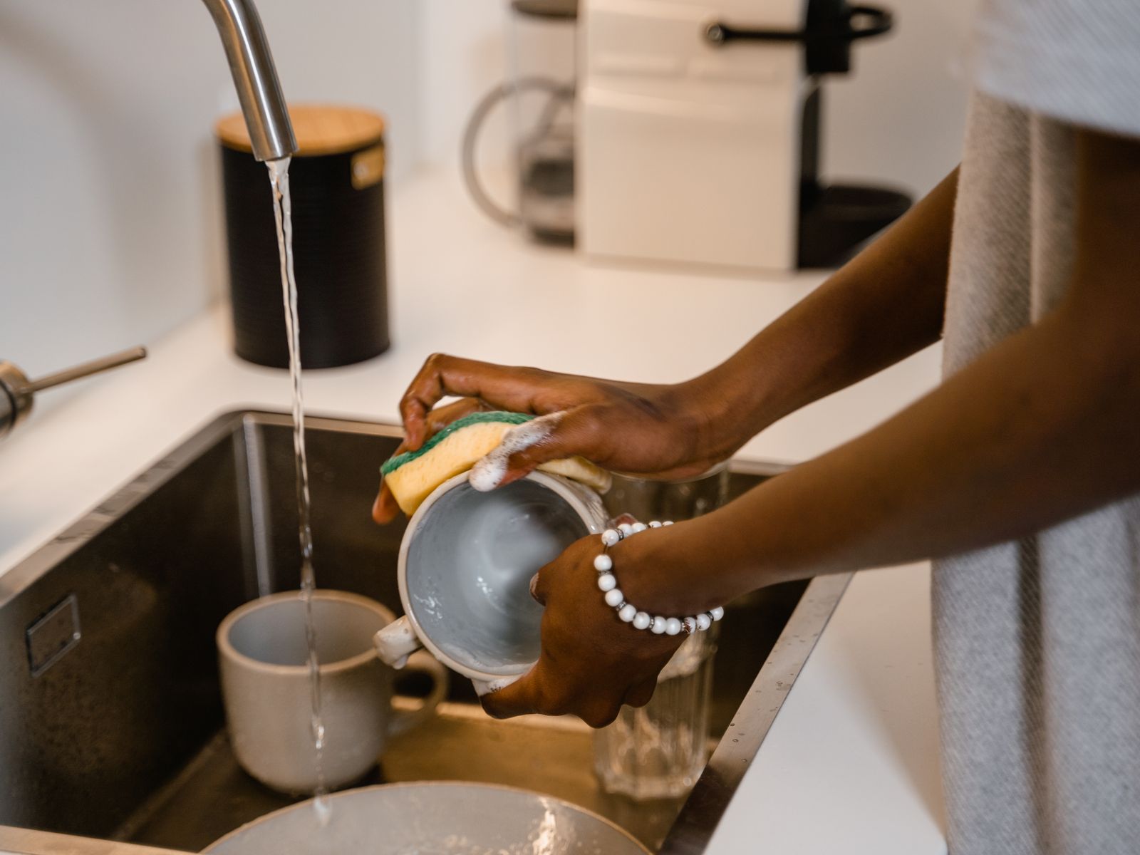 Washing the removable parts to clean your coffee maker of old coffee oils